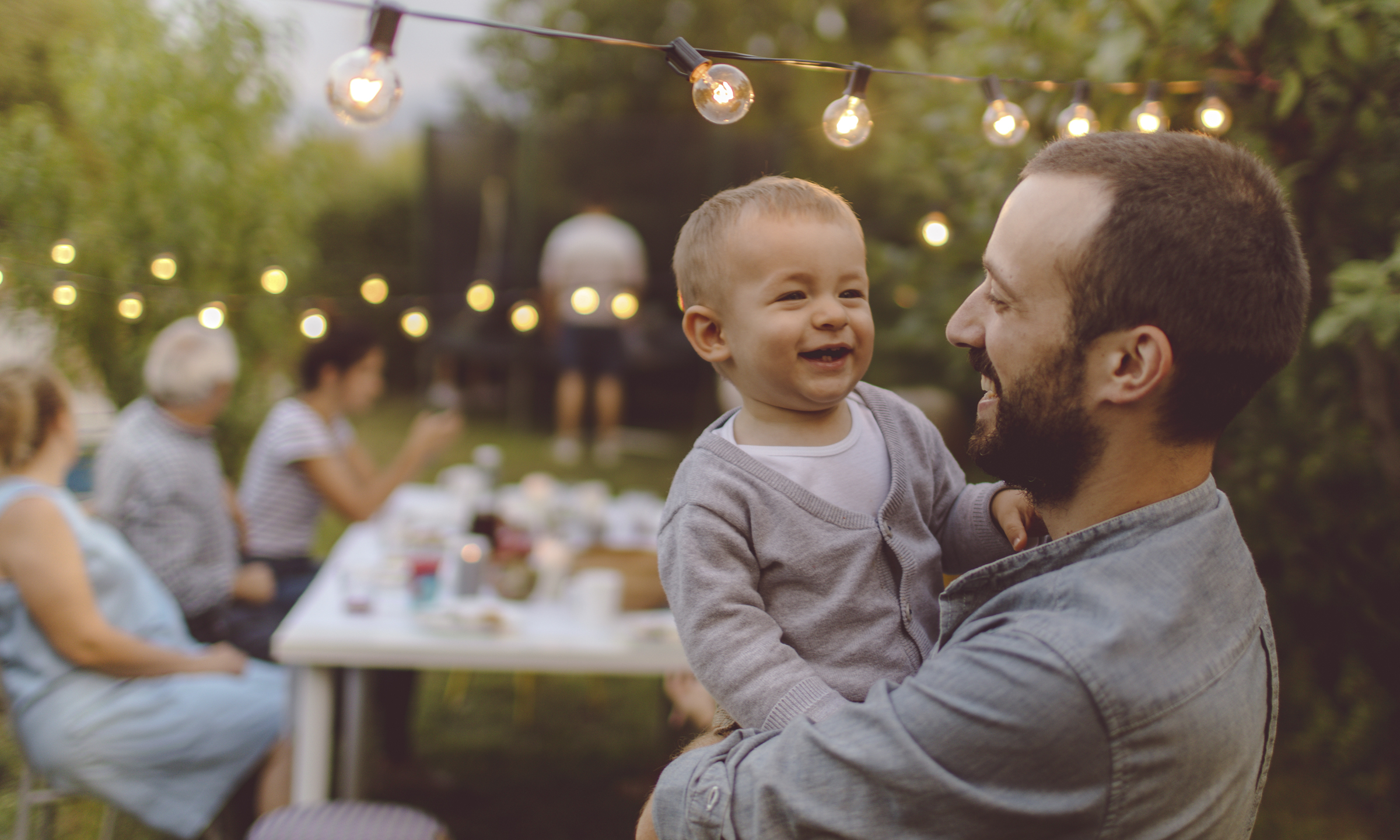 Young Father with Son at family event